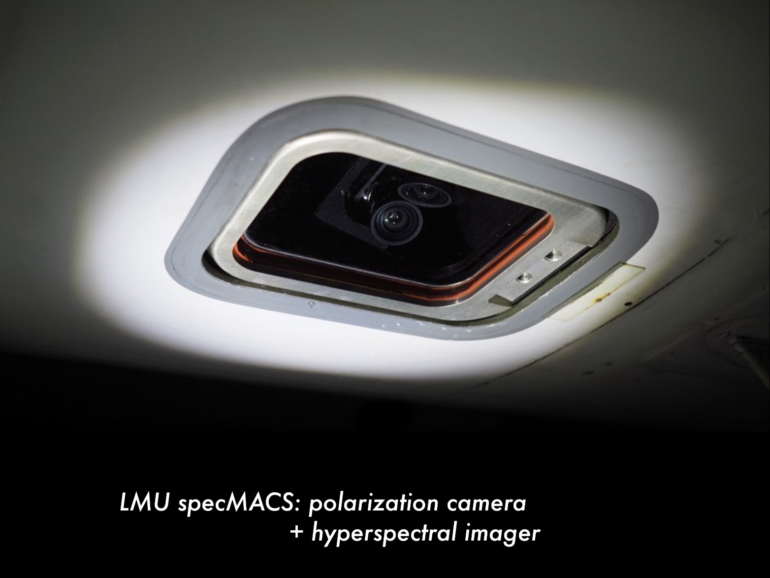 specMACS polarization camera and hyperspectral imager installed behind an aircraft window